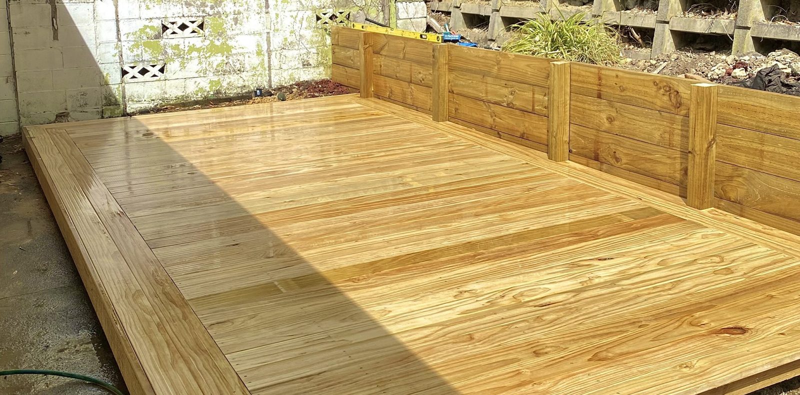 Timber deck and retaining wall project by Xtra Landscaping, serving Silverdale